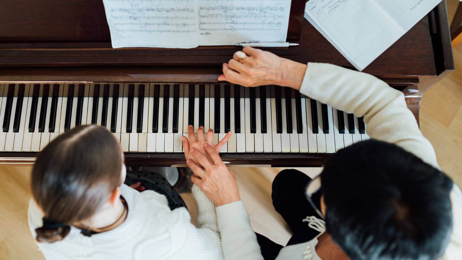 piano teacher teaching student